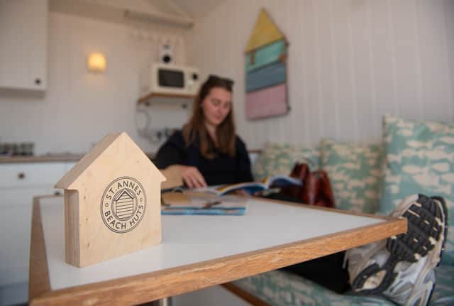 Reporter, Ciara Fearn, relaxing in a beach hut with coastal decor on seaside holiday in St Annes On Sea, Lancashire. Photo credit Lucinda Herbert