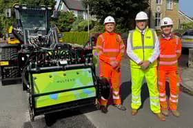 County Cllr Warren Goldsworthy (centre) has high hopes for the new pothole-filling technique being used in Lancashire
