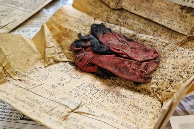 Piece of the dress that was used to identify Angela's sister 81 years ago