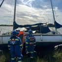 Two kittens were rescued alongside three crew members after a vessel ran aground near Over Wyre