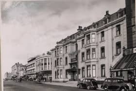 County Hotel on the corner of the promenade and Church Street. To the right is part of the glass canopy of The Palace