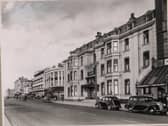 County Hotel on the corner of the promenade and Church Street. To the right is part of the glass canopy of The Palace