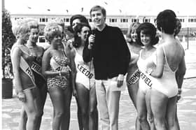 TV and radio personality Simon Dee with beauty queens from around the country in the 1960s