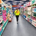 A woman walks in a section of cleaning products in a store of B&M. The retailer has revealed a £7 million accounting error caused by a system upgrade earlier this year (Photo: NICOLAS GUYONNET/Hans Lucas/AFP via Getty Images)          