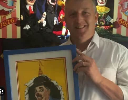 Nigel Male with picture of his idol, Charlie Cairoli