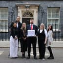 Webb delivering a 107,000 signature strong petition to 10 Downing St, alongside campaign partners from LadBaby, Metro and Feed UK
