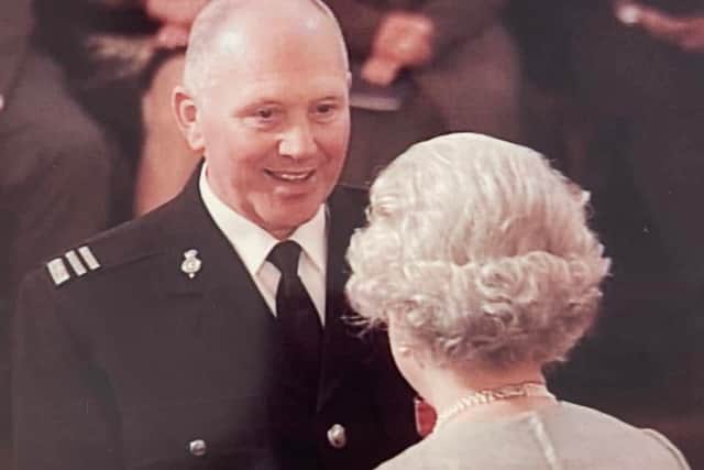 So proud: Peter Hutton receiving his MBE from The Queen back in 2002