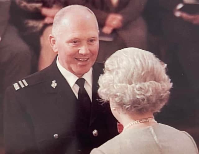 So proud: Peter Hutton receiving his MBE from The Queen back in 2002