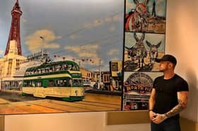 Adam Salisbury next to his artwork at Blackpool Teaching Hospital