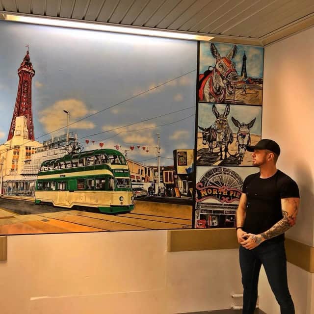 Adam Salisbury next to his artwork at Blackpool Teaching Hospital