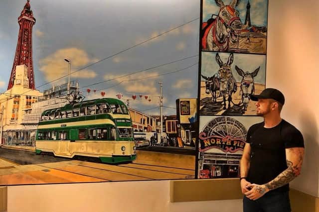 Adam Salisbury next to his artwork at Blackpool Teaching Hospital