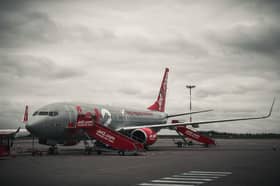 A man has been seriously injured after reportedly falling from the back of a plane at Manchester Airport.