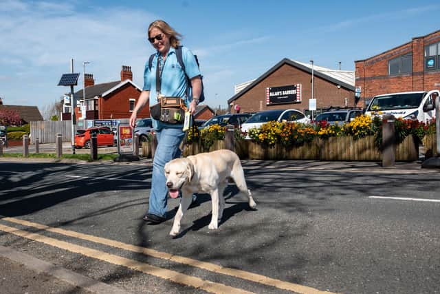 Lisa Allison, a volunteer puppy raiser, with trainee Guide Dog - 9 month old Topper. Lisa, from Broughton, Lancs wants to encourage more volunteer puppy raisers in Blackpool and Preston.