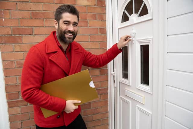 Postcode Lottery ambassador Matt Johnson as players in this Fylde coast street win £1,000 each in weekend draw. Credit: People’s Postcode Lottery