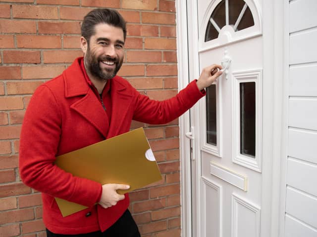 Postcode Lottery ambassador Matt Johnson as players in this Fylde coast street win £1,000 each in weekend draw. Credit: People’s Postcode Lottery