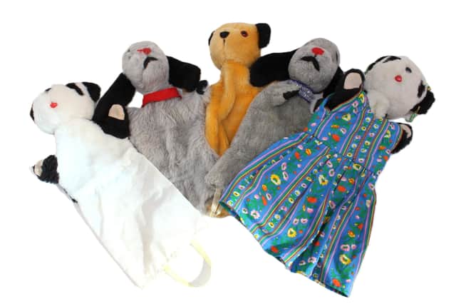 TV auctioneer Charles Hanson had his hands full with three of the most famous glove puppets in the world, owned by the legendary puppeteer Harry Corbett