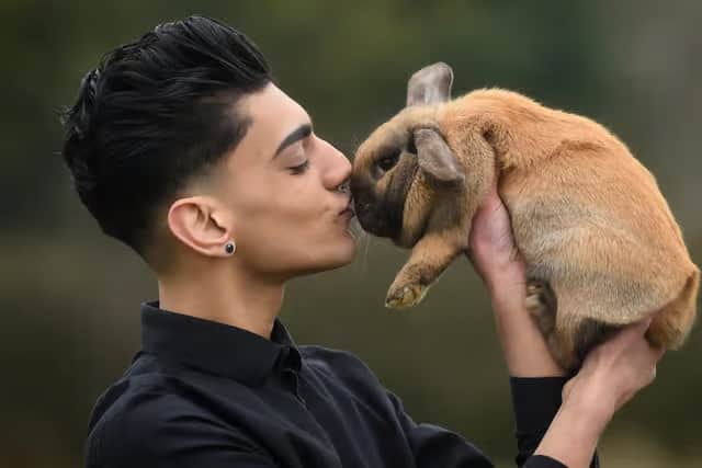 Bailey Lister with Daisy the rabbit at Hugo's Small Animal Sanctuary.