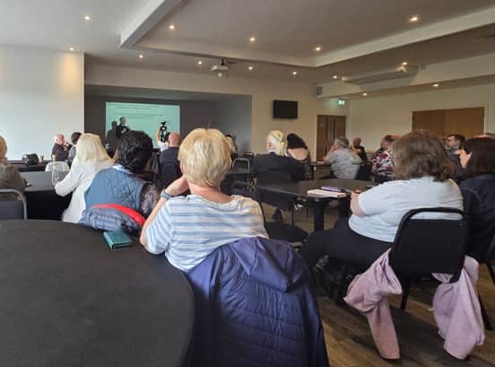 Residents listen to the panel of experts at the meeting in Thornton