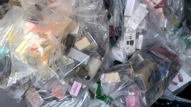 Hundreds of suspected fake perfume bottles and scores of suspected illicit Apple and Samsung products have been uncovered by Trading Standards at Norcross Car Boot