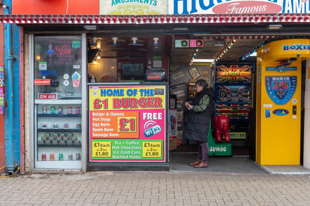 The owner of "Britain's cheapest burger" has revealed how he keeps the cost at £1 after 20 years in business.