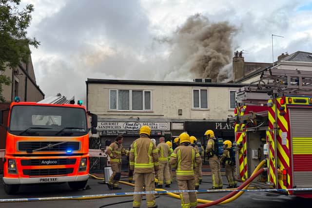 Firefighters responding to a major fire at the former Ex Catalogue store and M&S in Lord Street, Fleetwood. Huge flames and thick black smoke can be seen billowing across the town