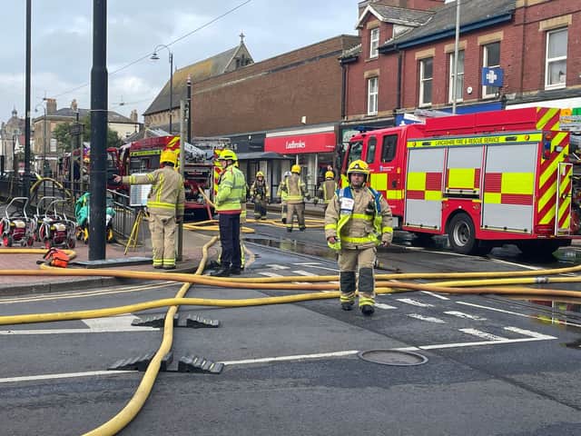 Firefighters are responding to a major fire at the former Ex Catalogue store and M&S in Lord Street, Fleetwood. Huge flames and thick black smoke can be seen billowing across the town