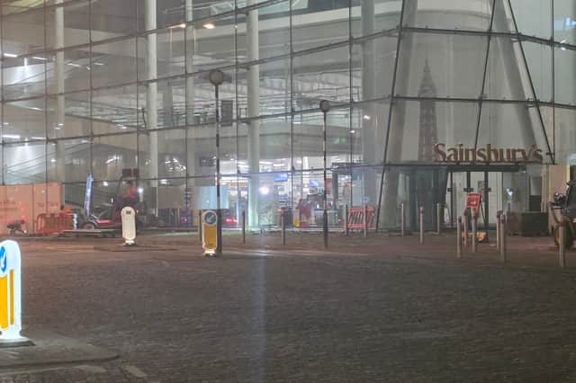 The hoardings being removed from the Talbot Road Sainsbury's store in Blackpool