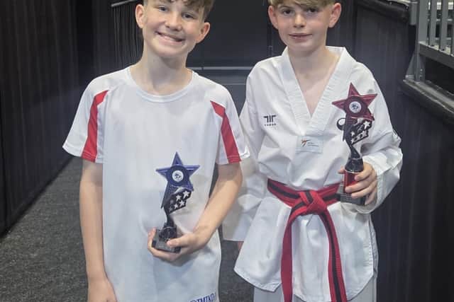 Fleetwood's Mount Taekwondo students proudly holding their trophies after both youngsters competed at a British Taekwondo competition at the Barnsley Metrodome. Pictured left, Isaac Blundell, right Jake Lightfoot.