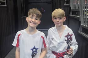 Fleetwood's Mount Taekwondo students proudly holding their trophies after both youngsters competed at a British Taekwondo competition at the Barnsley Metrodome. Pictured left, Isaac Blundell, right Jake Lightfoot.