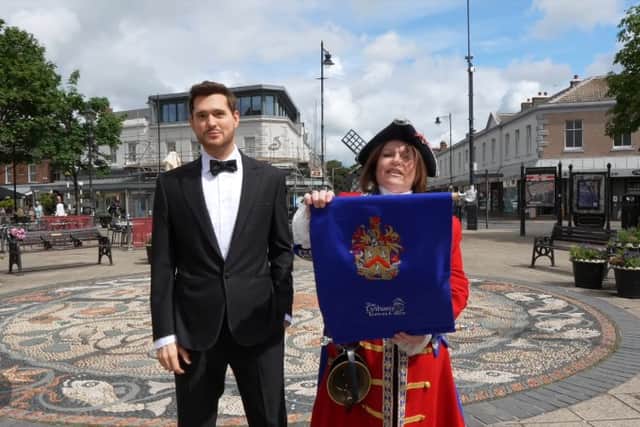 Michael Bublé’s wax figure and Lytham Town Crier Kila Redfearn on Clifton Square, Lytham.