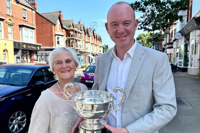 Andrew Snowden MP and Margaret Race with the Best Shop trophy