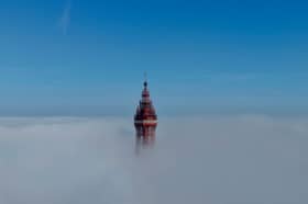 The Grade 1 listed Blackpool Tower peeks out from the clouds ahead of another scorching day at the northern seaside resort. 