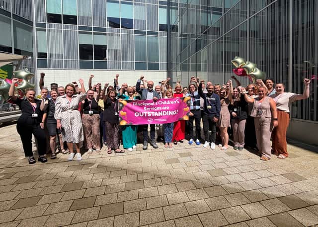 Staff and senior leader from children’s services celebrate their Ofsted rating with cabinet members Cllr Kath Benson, Cllr Lynn Williams, and Cllr Jim Hobson