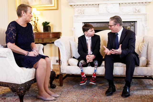 Sir Keir Starmer with Paula and Tony Hudgell in No 10 (Dan Kitwood/PA)