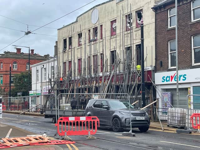 Workmen are on site in Fleetwood removing the scaffolding holding up severely fire damaged former Ex-Catalogue Shop building in Lord Street