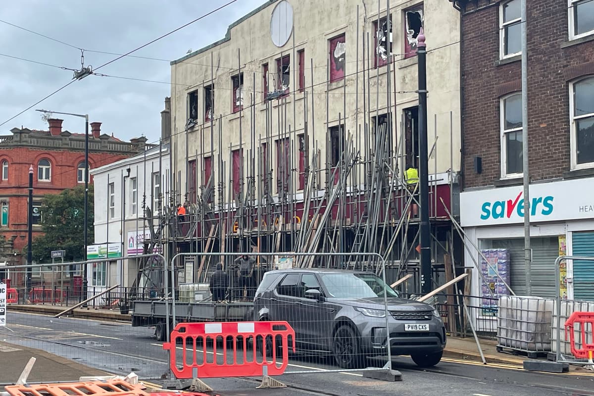 Scaffolding being removed from fire-damaged former ex-catalogue shop and ...