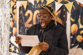Jane Idiasirue screams with joy as she opens her GCSE results at South Shore Academy