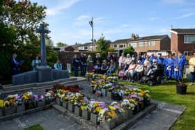 Members of the public listen on at the Freckleton Air Disaster Memorial at Holy Trinity Church. Photo: Kelvin Lister-Stuttard