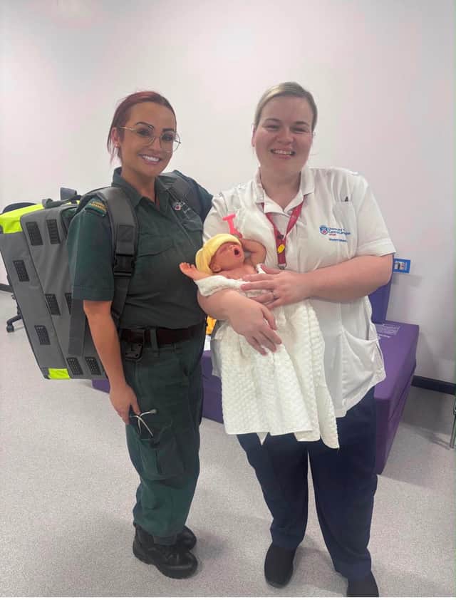Katie Hey with a colleague during her training.