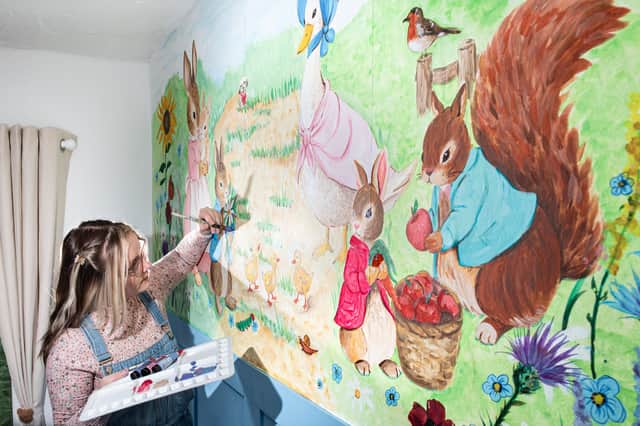 Natalie Percival aka Nat Paints Little Worlds with her Peter Rabbit inspired wall mural painted in a children's nursery room. Photo: Lucinda Herbert