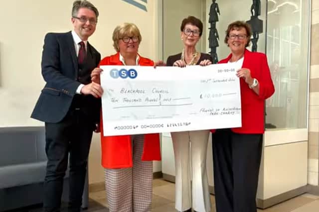 Cllr Jane Hugo (right) with the three ward councillors and the cheque for £10,000