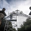 Alan Darlington from Evolution painting the gates at Stanley Park
