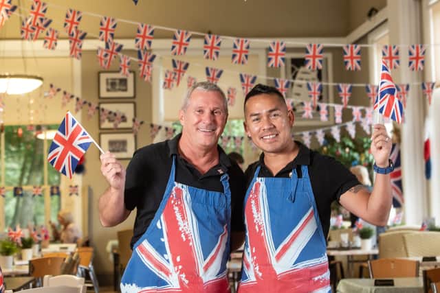 Stephen Hall and Carlos Cabrera from the Parks Art Deco Cafe in Stanley Park, have decorated inside and outside in flowers and bunting in for the park's centenary year and a Royal visitor.