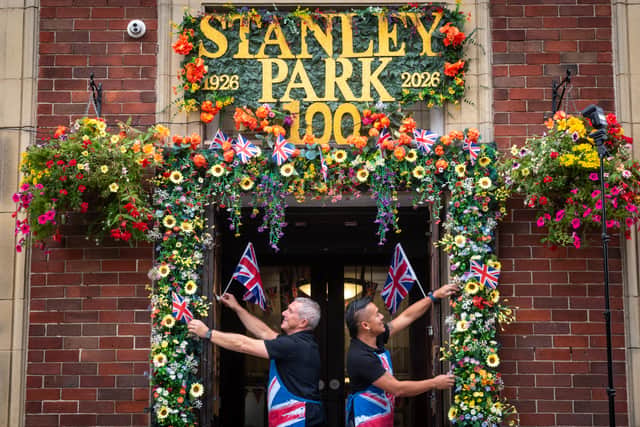 Stephen Hall and Carlos Cabrera from the Parks Art Deco Cafe in Stanley Park, have decorated inside and outside in flowers and bunting in for the park's centenary year and a Royal visitor.