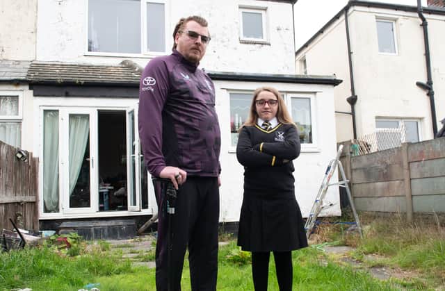 David Allum with daughter Chloe Allum, 11, who was put in 'inclusion' for wearing an un-branded skirt to school.