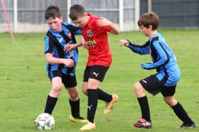 Under-11s action with Freckleton FC (in red) and Poulton FC Blacks
