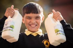 Pupils from Chaucer Primary School are given free fresh milk from Fernhill Farm to celebrate World School Milk Day