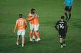 Albie Morgan, right, is congratulated after his second goal