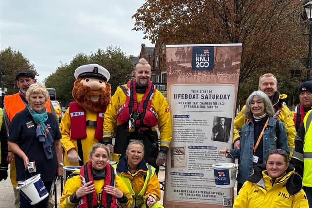 RNLI crew members and supporters ready to collect