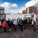 Cllr Mark Smith, Cabinet Member for Economy and Built Environment at Blackpool Council; Alun Francis, Chief Executive of Blackpool and The Fylde College (holding the scissors) with members of the wider project team.